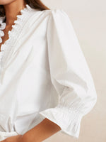Blouse with v-neck and ruffles